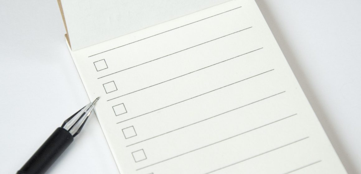 Blank to do list planner with checklist and black pen on white b